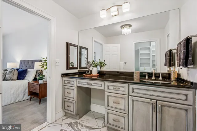 a kitchen with stainless steel appliances granite countertop a sink and cabinets