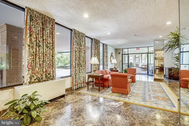 a view of a house with swimming pool and a yard
