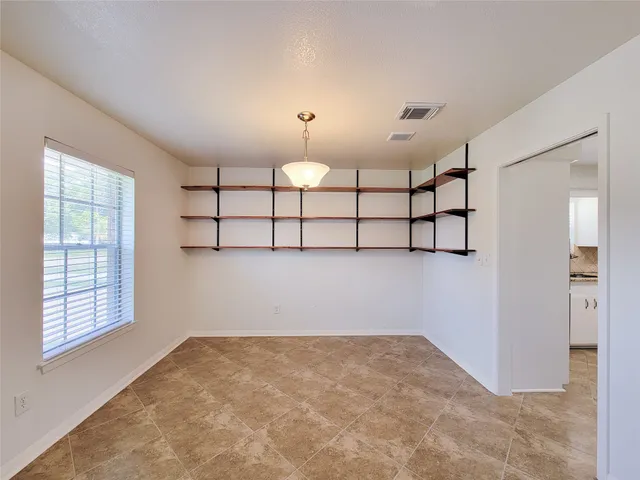a view of an empty room and window
