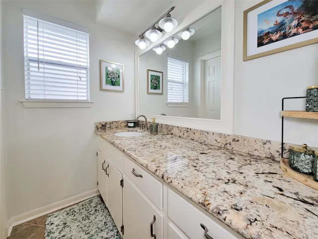 a bathroom with a toilet and a shower curtain