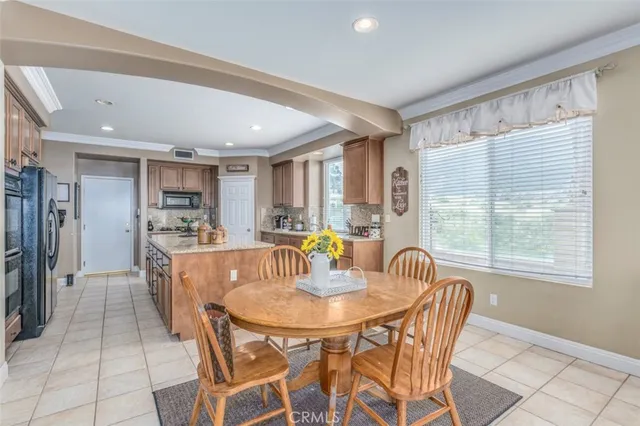 a dining room with furniture and window