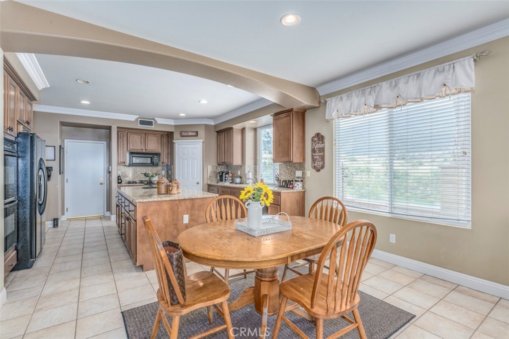980 Nicholas Place Corona, CA 92882 - Photo 11 of 46 a dining room with furniture and window