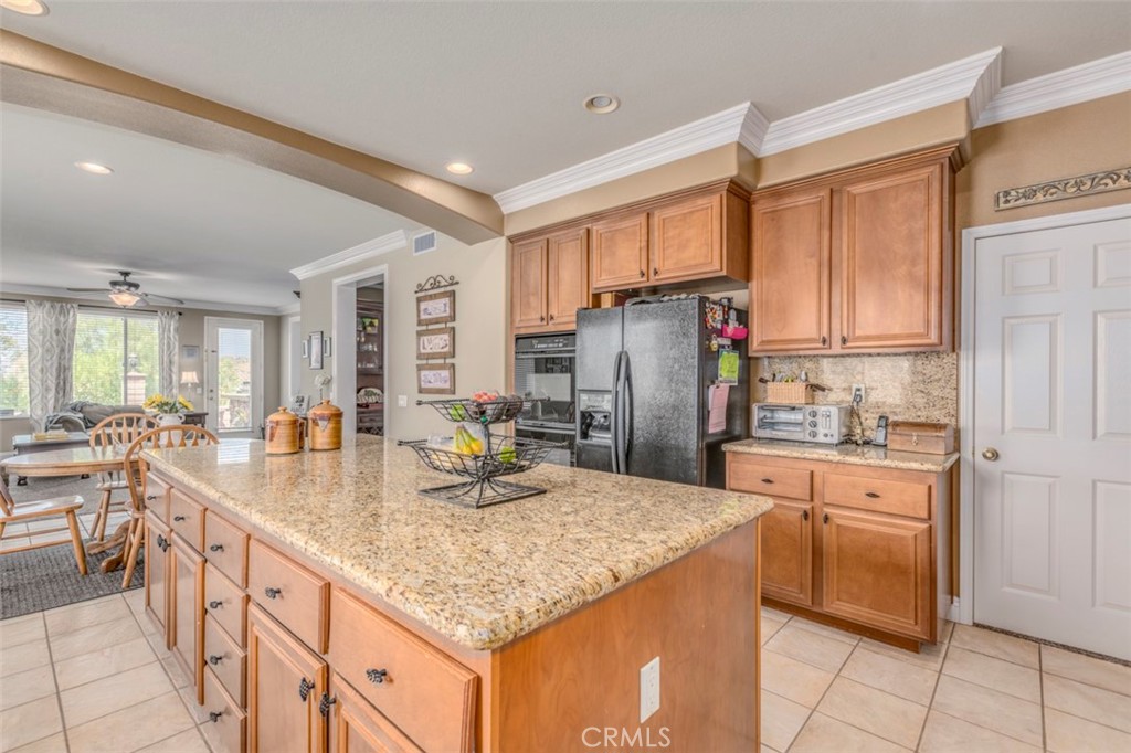 980 Nicholas Place Corona, CA 92882 - Photo 18 of 46 a kitchen with refrigerator and cabinets