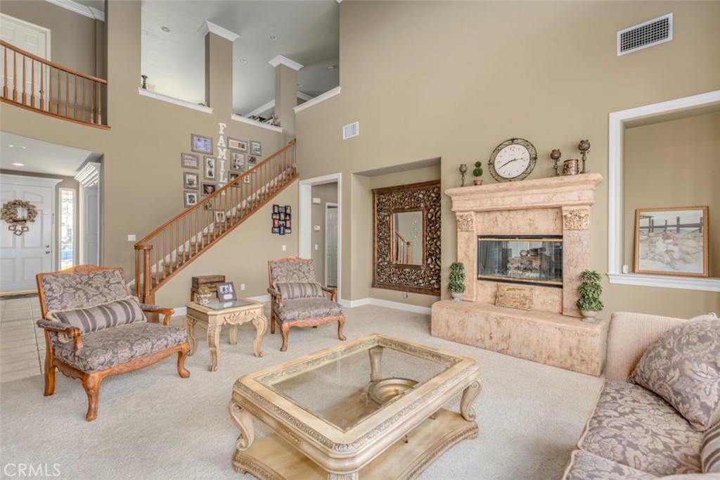 980 Nicholas Place Corona, CA 92882 - Photo 24 of 46 a living room with furniture and a fireplace