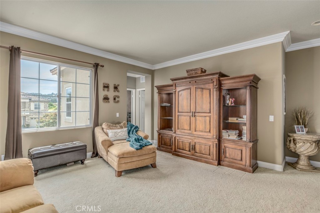 980 Nicholas Place Corona, CA 92882 - Photo 30 of 46 a living room with furniture and a window