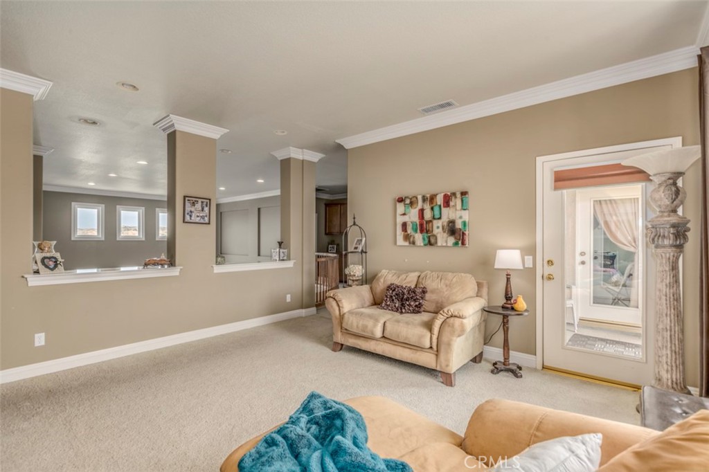 980 Nicholas Place Corona, CA 92882 - Photo 31 of 46 a living room with furniture and a window