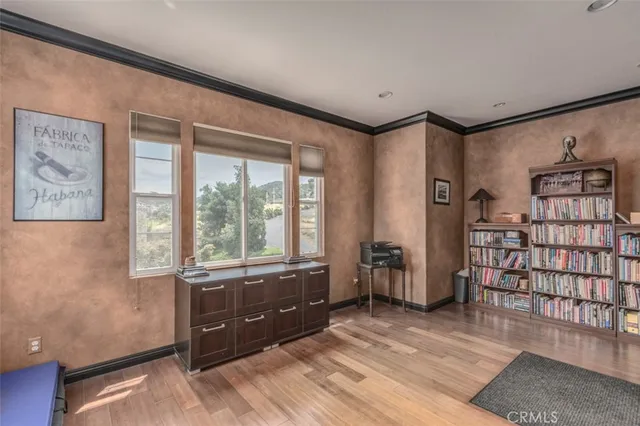 a bed room with a bed and a ceiling fan