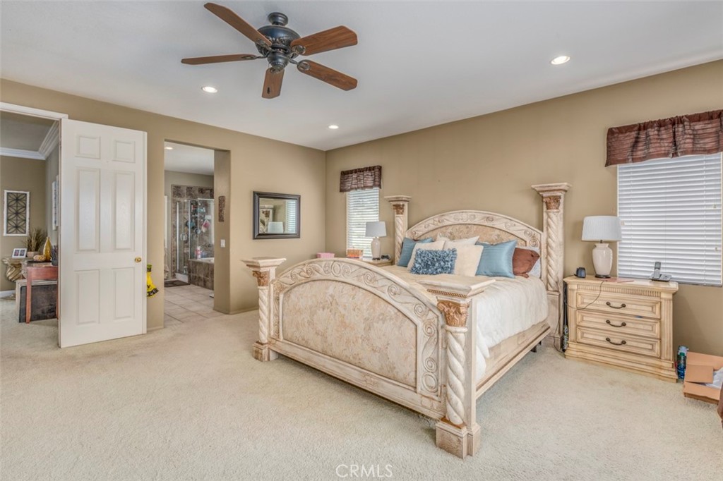 980 Nicholas Place Corona, CA 92882 - Photo 34 of 46 a bed room with a bed and a ceiling fan