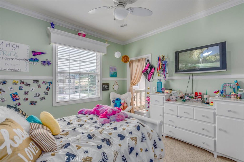 980 Nicholas Place Corona, CA 92882 - Photo 40 of 46 a bed room with a bed couch and a window