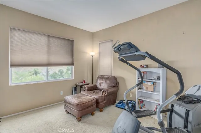 a view of a patio with table and chairs and potted plants