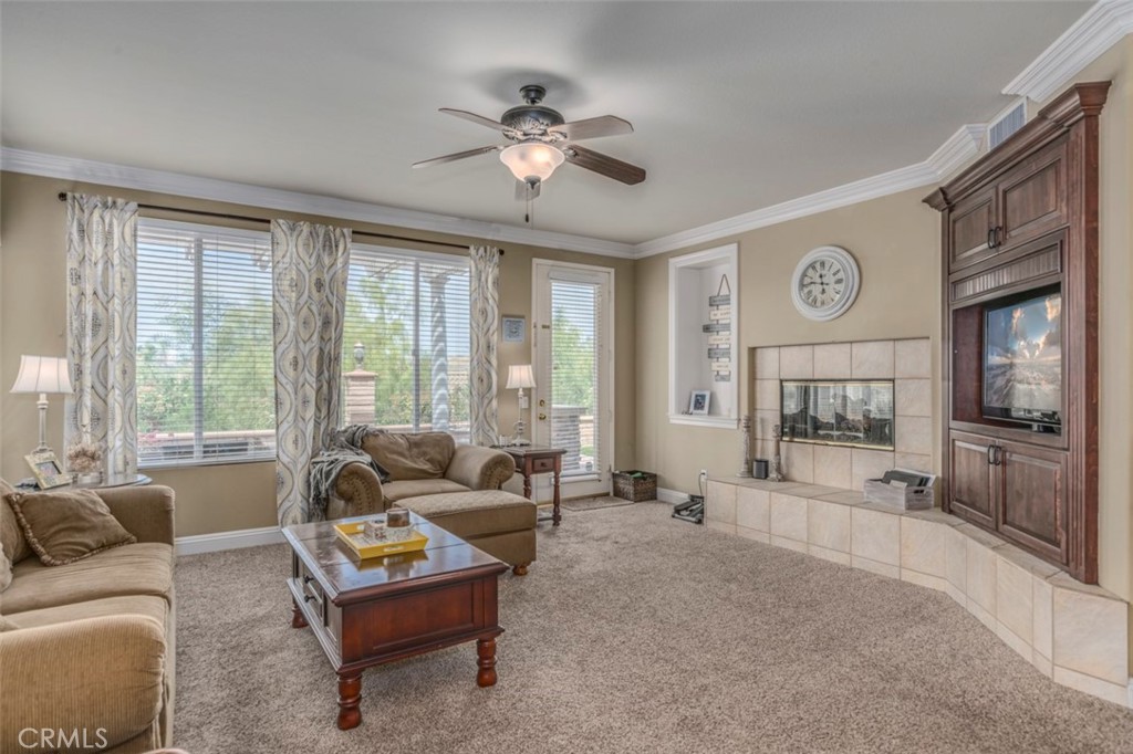 980 Nicholas Place Corona, CA 92882 - Photo 8 of 46 a living room with furniture and a large window