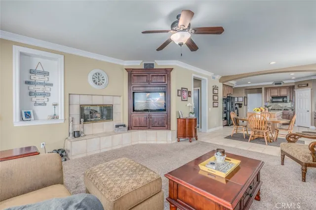a living room with furniture and kitchen view