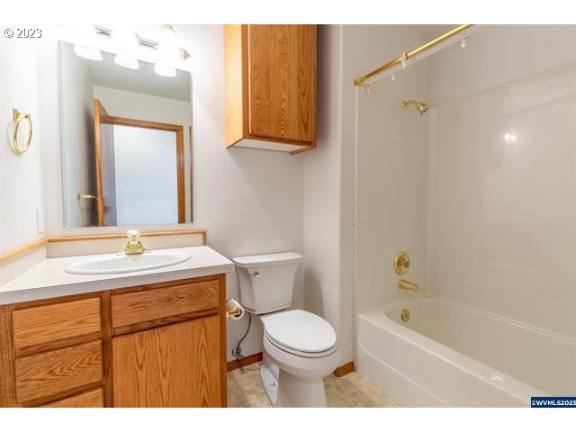 3014 View Lane Lebanon, OR 97355 - Photo 15 of 29 a bathroom with a sink a toilet and shower