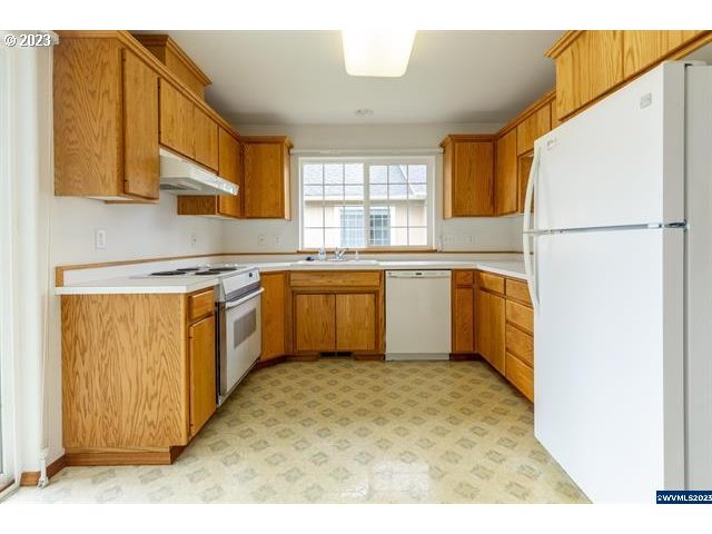 3014 View Lane Lebanon, OR 97355 - Photo 26 of 29 a kitchen with a sink a window and stainless steel appliances