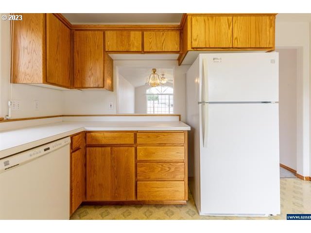 3014 View Lane Lebanon, OR 97355 - Photo 28 of 29 a white refrigerator freezer sitting in a kitchen