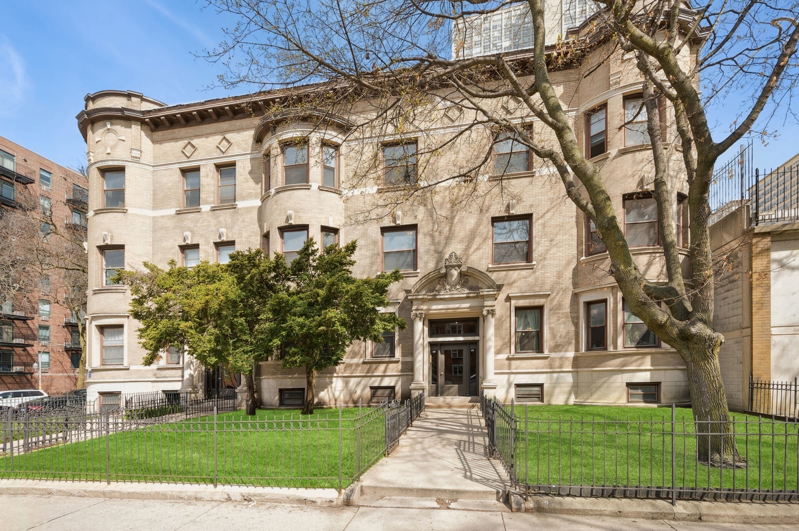 a front view of a building with garden