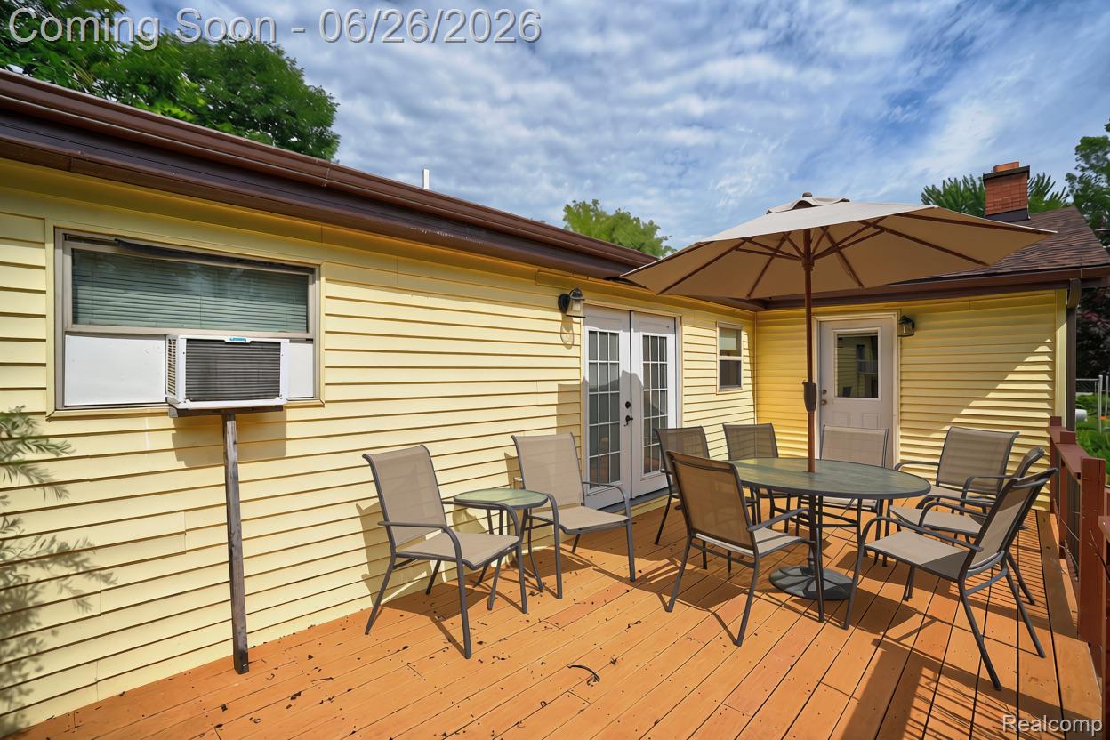 5366 East Mt Morris Road Mount Morris, MI 48458 - Photo 45 of 57 AI Edited Spacious outdoor deck featuring wood flooring and a perimeter railing