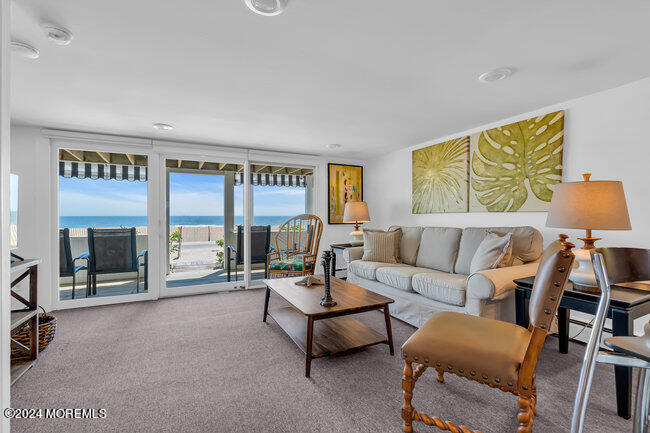 157 Beach Front Manasquan, NJ 08736 - Photo 15 of 47 a living room with furniture and a fireplace