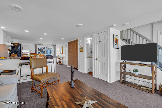 157 Beach Front Manasquan, NJ 08736 - Photo 17 of 47 a view of a livingroom with furniture and a flat screen tv