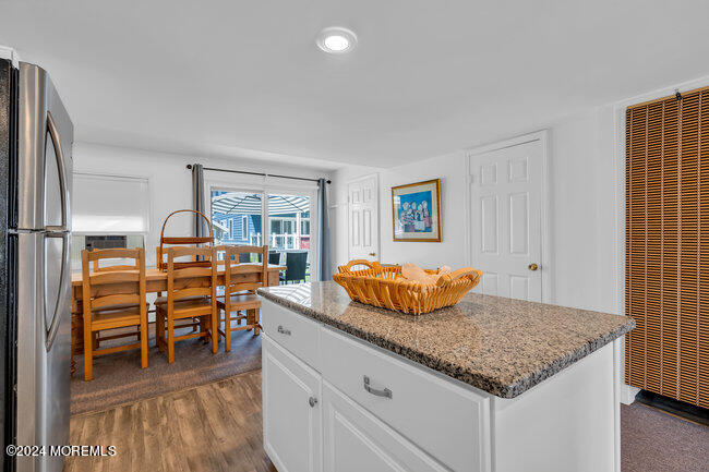 157 Beach Front Manasquan, NJ 08736 - Photo 20 of 47 a kitchen with stainless steel appliances granite countertop a sink and a refrigerator