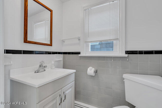 157 Beach Front Manasquan, NJ 08736 - Photo 25 of 47 a bathroom with a sink and a mirror