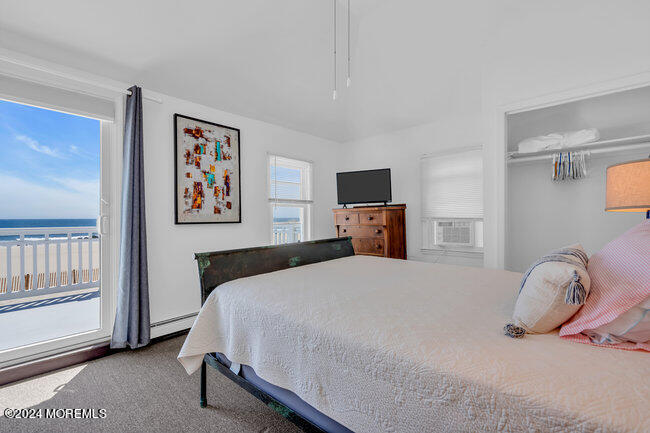 157 Beach Front Manasquan, NJ 08736 - Photo 28 of 47 a bedroom with a bed and a tv on the dresser