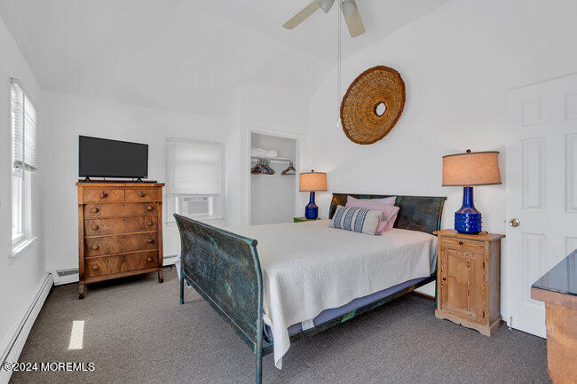 157 Beach Front Manasquan, NJ 08736 - Photo 29 of 47 a bedroom with a bed and a lamp on dresser