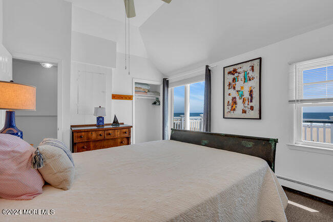 157 Beach Front Manasquan, NJ 08736 - Photo 31 of 47 a bedroom with a bed and a painting on the wall