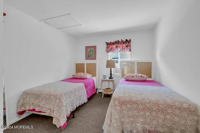 a bedroom with bed and window