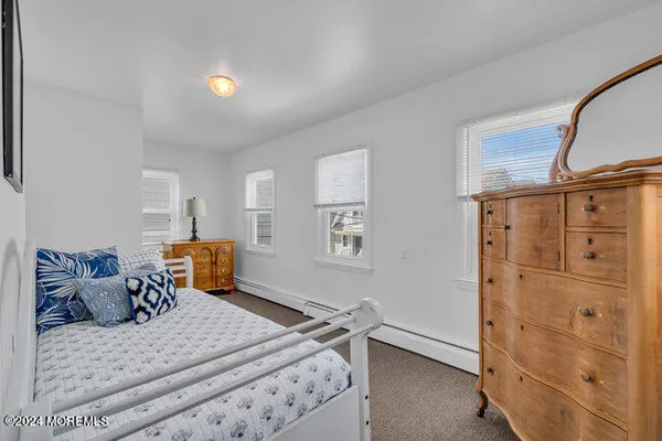 a bedroom with a bed and cabinets
