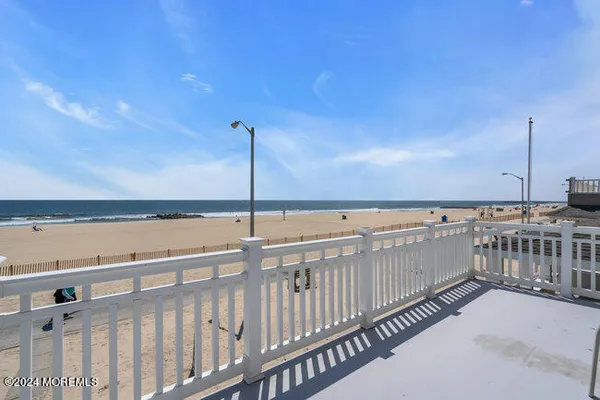 a view of a balcony with an ocean view