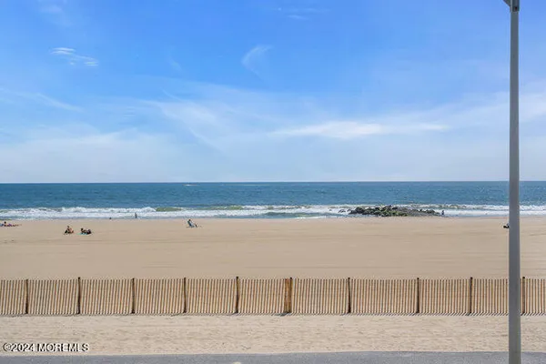 a view of a balcony with potted plants