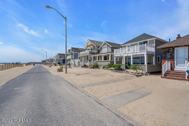 157 Beach Front Manasquan, NJ 08736 - Photo 45 of 47 a city street lined with buildings and cars