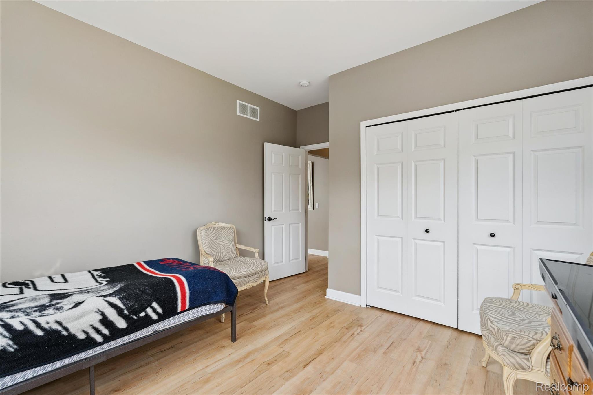 441 West Dryden Road Metamora, MI 48455 - Photo 34 of 62 Bedroom featuring light wood-style floors and a closet