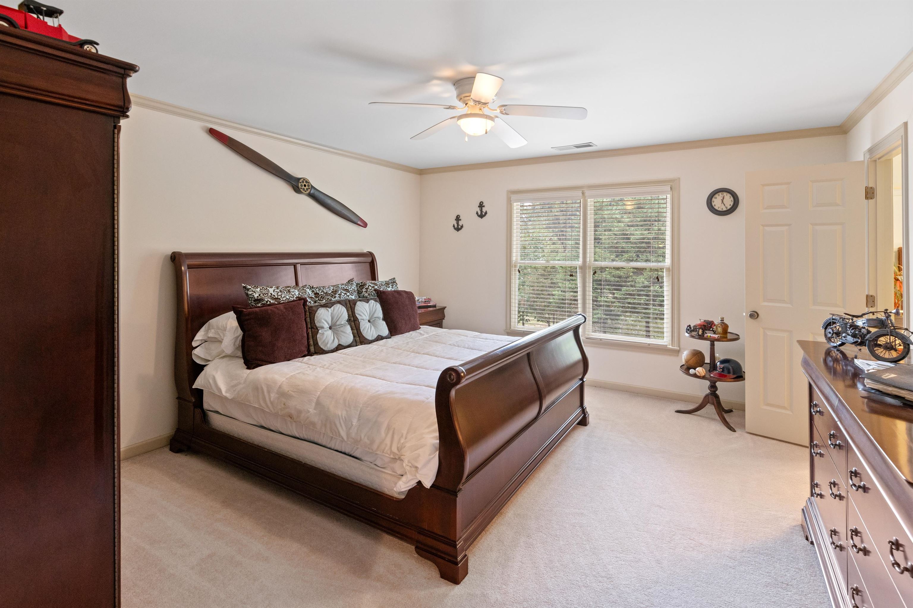 11241 Latting Road Eads, TN 38028 - Photo 28 of 31 a bedroom with a bed and a chandelier