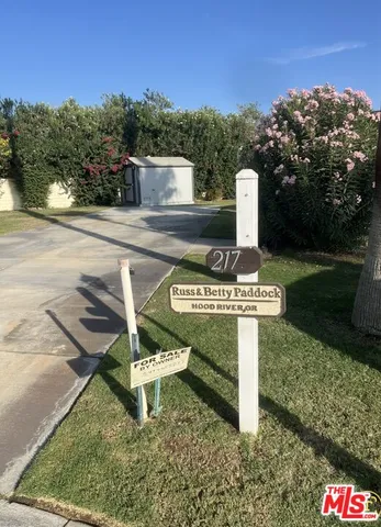 a view of a park with iron fence