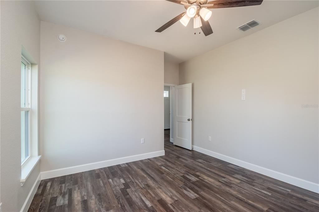 2073 Northwest 79th Loop Ocala, FL 34475 - Photo 51 of 75 wooden floor in an empty room