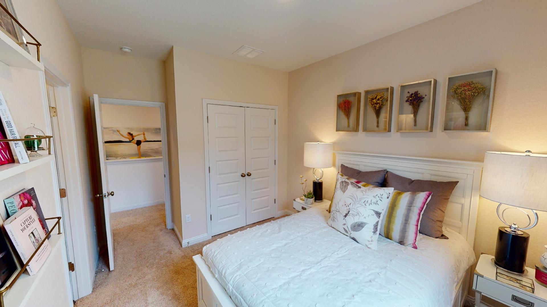 8113 Springsteen Drive Austin, TX 78744 - Photo 10 of 10 Bedroom with a closet and light carpet