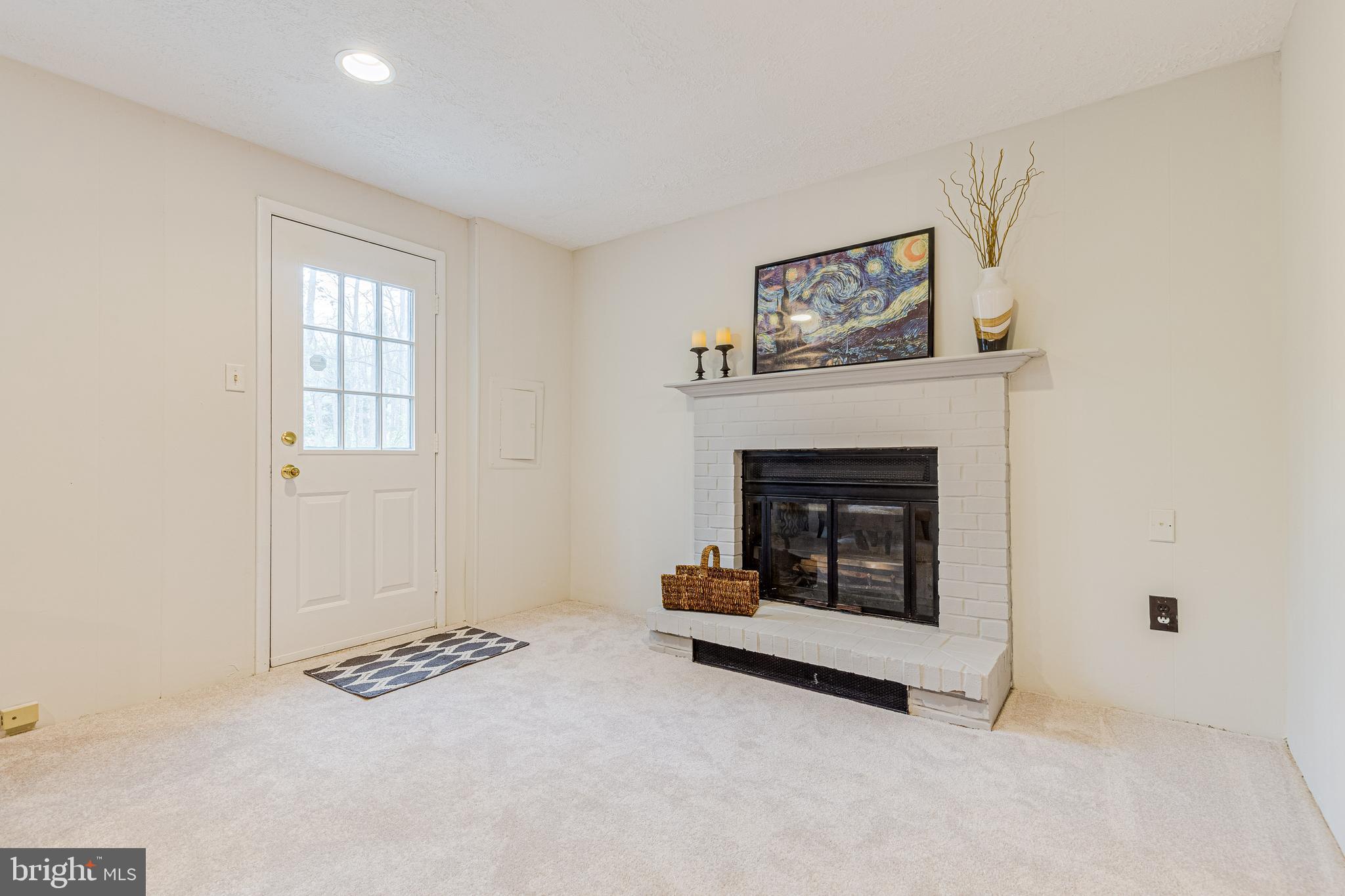11500 Ivy Bush Court Reston, VA 20191 - Photo 26 of 33 Wood burning fireplace with rear door access.