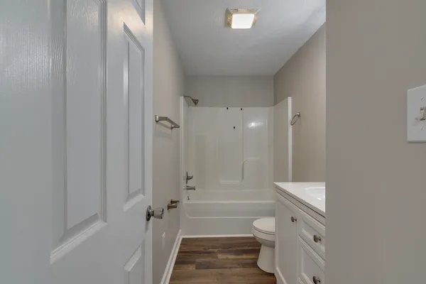 a bathroom with a sink a toilet and a bathtub