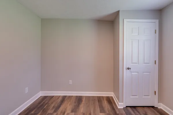 a view of a kitchen with wooden floor