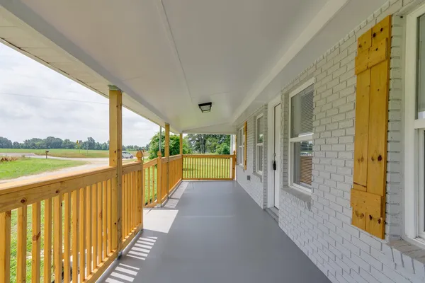a view of a kitchen with a sink and a refrigerator