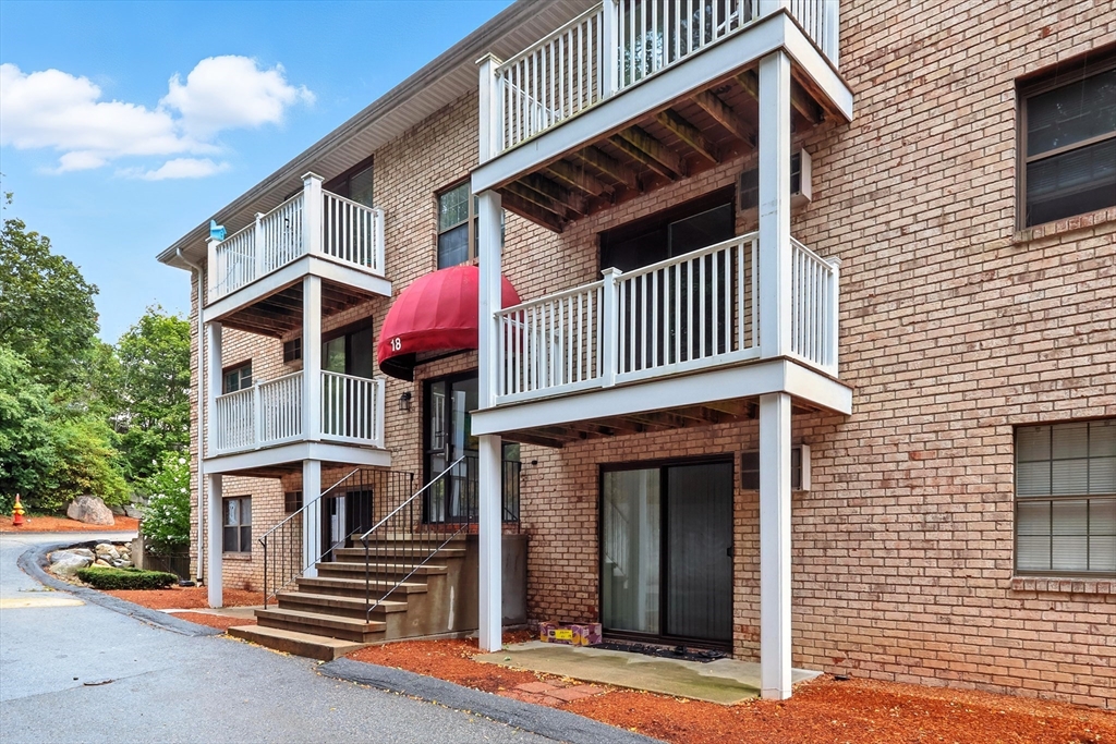 a front view of a house with entryway and a garage