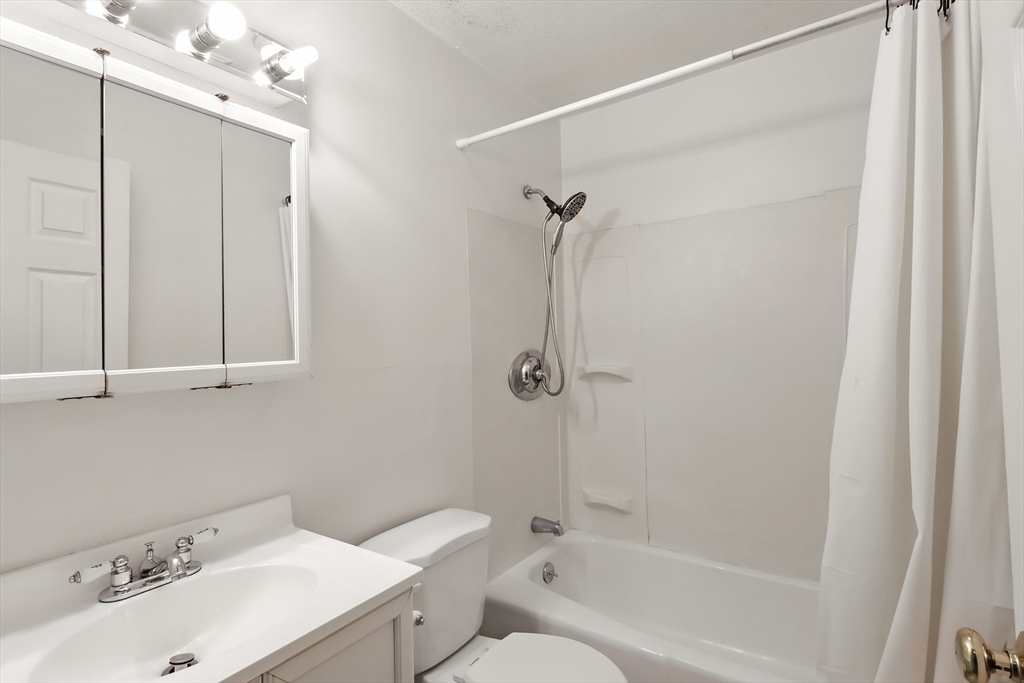 18 Kenmar Drive, Unit 149 Billerica, MA 01821 - Photo 11 of 13 a bathroom with a sink a toilet and shower