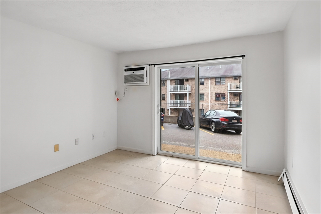 18 Kenmar Drive, Unit 149 Billerica, MA 01821 - Photo 3 of 13 a view of a livingroom with a storage & utility room
