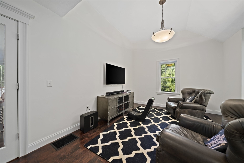 340 Old Oaken Bucket Road Norwell, MA 02061 - Photo 14 of 37 a living room with furniture and a flat screen tv