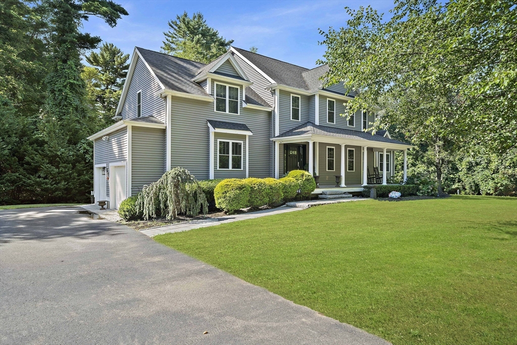 340 Old Oaken Bucket Road Norwell, MA 02061 - Photo 2 of 37 a front view of a house with a yard