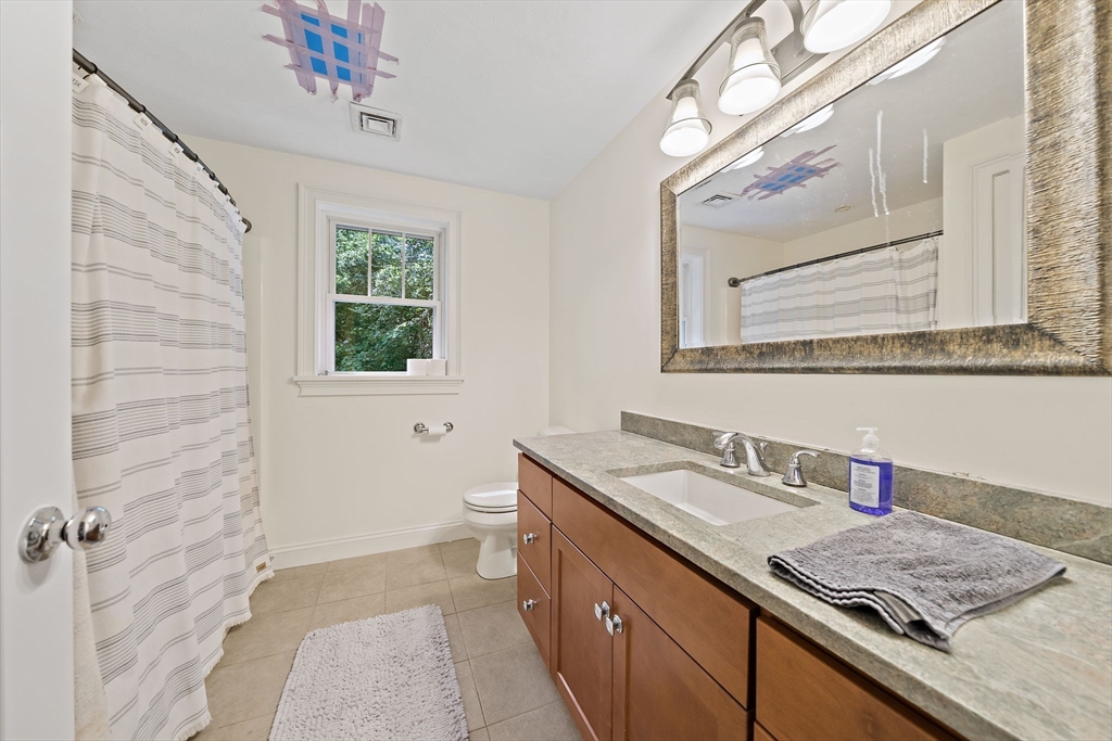 340 Old Oaken Bucket Road Norwell, MA 02061 - Photo 24 of 37 a bathroom with a sink a vanity and a mirror