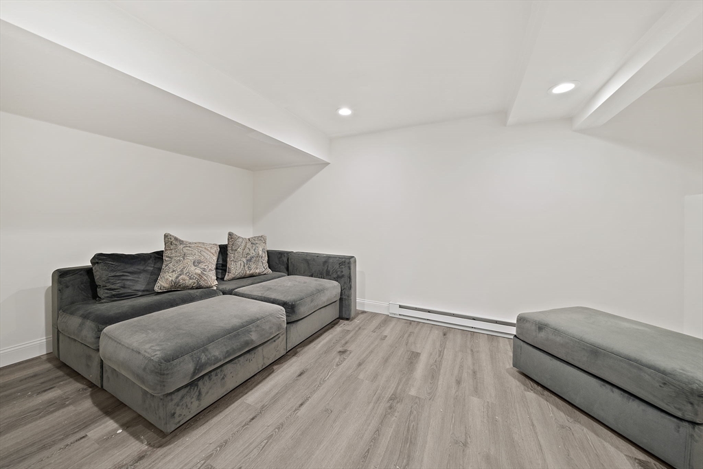 340 Old Oaken Bucket Road Norwell, MA 02061 - Photo 25 of 37 a living room with furniture and a wooden floor