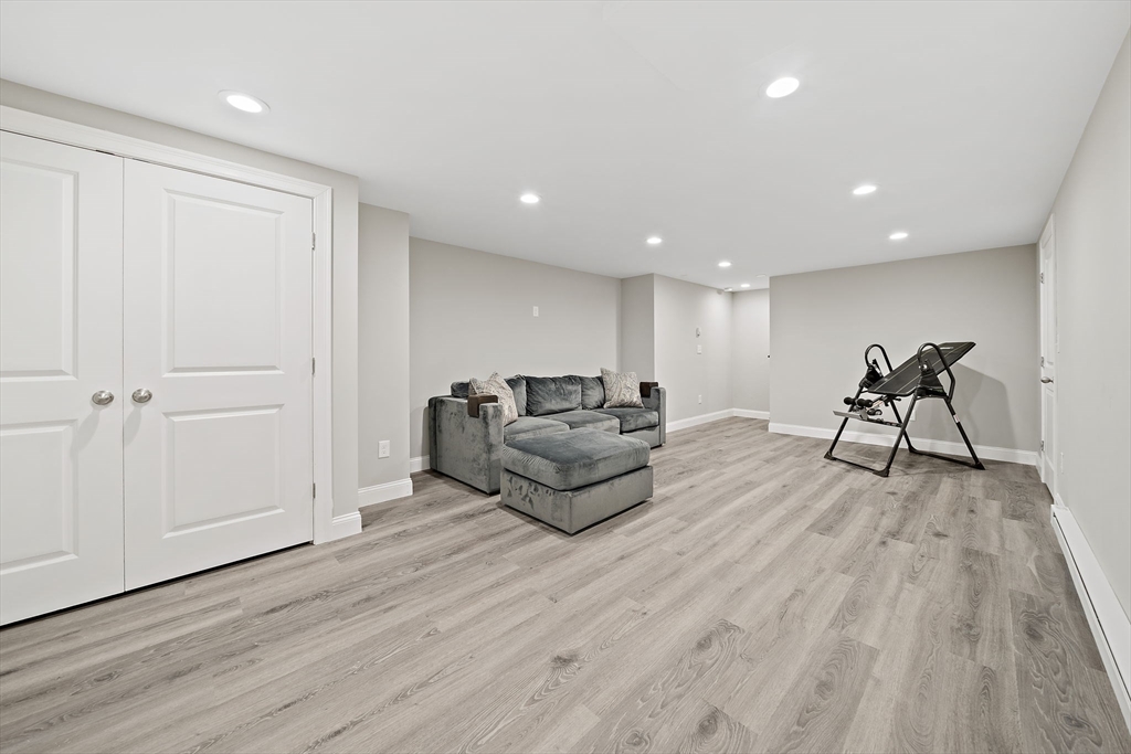 340 Old Oaken Bucket Road Norwell, MA 02061 - Photo 28 of 37 a living room with furniture and a wooden floor